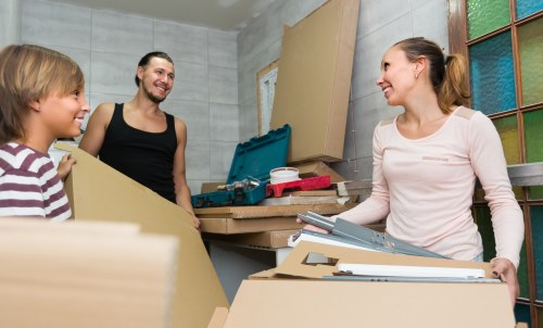 Professional movers handling a flat removal in Queenspark with boxes and furniture