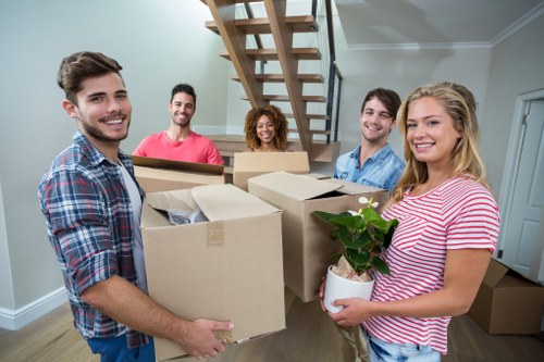 Professional removals team handling boxes in Queenspark