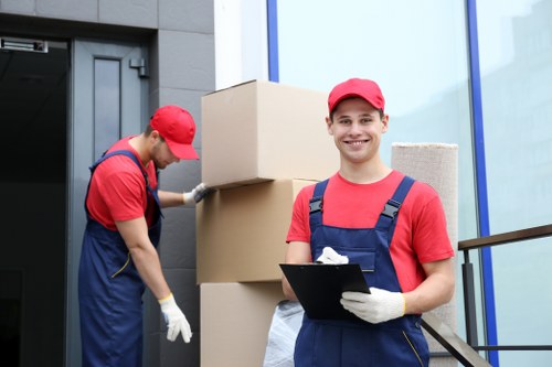 Small removals service in Queenspark with moving van and packed boxes