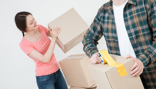 Professional removals and storage services in Queenspark with moving boxes and furniture