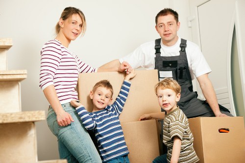 Stacked boxes and furniture stored safely in Queenspark household storage