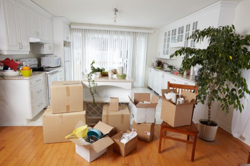 Furniture being carefully carried down stairs during a Queenspark flat move