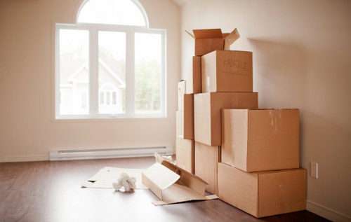 Careful loading of household items during a small move in Queenspark