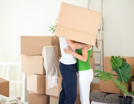Packed moving boxes and furniture ready for Queenspark removals