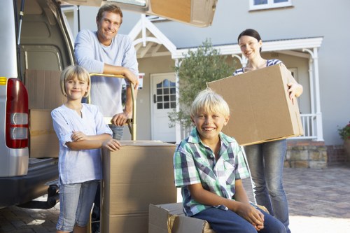 Professional movers handling furniture for a small removal in Queenspark